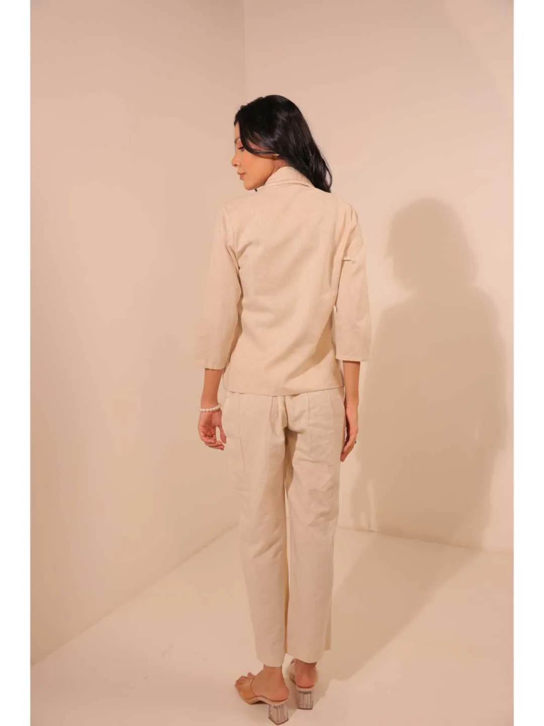 modish cotton linen lapel collared stylised shrug style jacket with running stitch detailings. - Beige